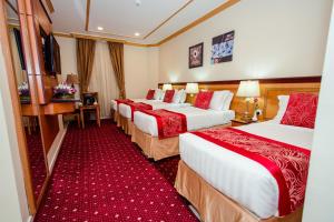 Postel nebo postele na pokoji v ubytování Sama Al Deafah Hotel + 37 fotografií