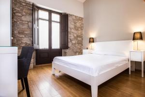 Posteľ alebo postele v izbe v ubytovaní Girona Housing Ginesta 9