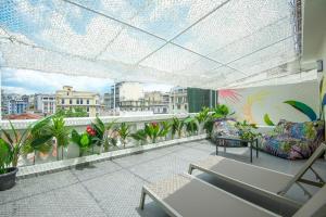 a balcony with a view of a city at Colors Urban Hotel Thessaloniki in Thessaloniki