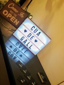 a lit up sign on top of a vending machine at Girona Housing Ginesta 9 in Girona