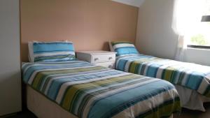 Säng eller sängar i ett rum på Lavendel Cottage