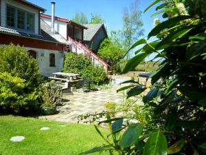 a patio in front of a house at Lille Degnbøl in Degnbøl