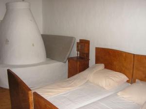 Кровать или кровати в номере Ven Eperfa Vendeghaz