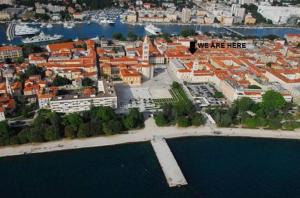 an aerial view of a city with the words we are here at Top Center Zadar Studio Apartments in Zadar
