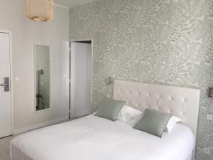 Letto o letti in una camera di Hôtel Central