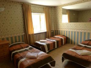 Postel nebo postele na pokoji v ubytování Viva Pirita Hostel
