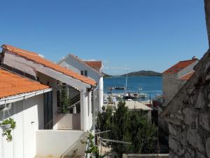 a view of the water from between buildings at Apartments Violeta in Betina