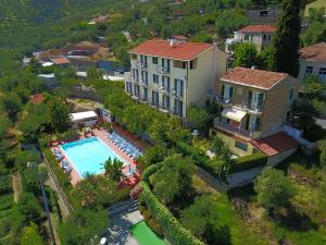 an aerial view of a house with a swimming pool at Residence Elvira in Diano Marina +28 photos