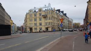a city street with a large building on the side of the road at 2ndhomes Kamppi Apartments 2 in Helsinki