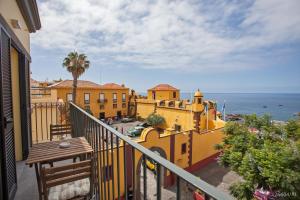 a balcony of a building with a view of the ocean at Zona Velha Apartments by An Island Apart in Funchal