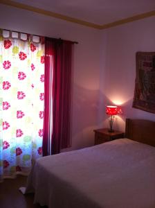 Uma cama ou camas num quarto em Casa do Cabo de Santa Maria