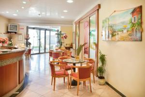 TV a/nebo společenská místnost v ubytování Hotel Villa Gori