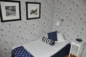 Letto o letti in una camera di Strand Hotell