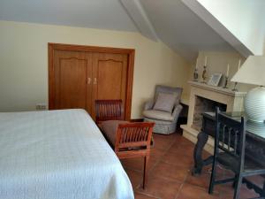 A bed or beds in a room at La Princesa