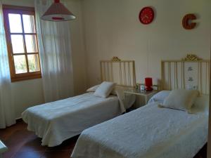 A bed or beds in a room at La Princesa