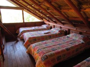 Ένα ή περισσότερα κρεβάτια σε δωμάτιο στο Cabañas Manantiales de Obligado