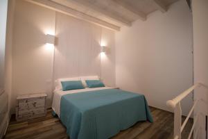 Cama ou camas em um quarto em Casa Martina