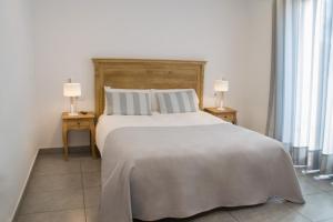 Llit o llits en una habitació de Hostal Portofino