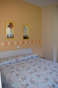 Letto o letti in una camera di Albergo De Jean