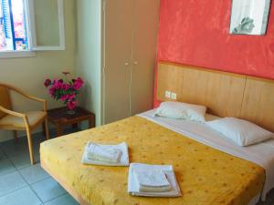 Ένα ή περισσότερα κρεβάτια σε δωμάτιο στο Villa Markos