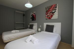 Posteľ alebo postele v izbe v ubytovaní For a Stay Las Dunas