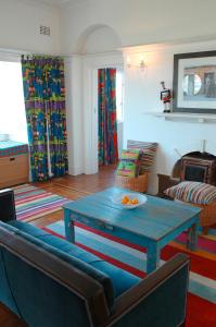 a living room with a blue table and a couch at Blue On Blue Bed and Breakfast in St. James