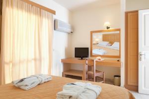 Кровать или кровати в номере Mare Hotel Apartments