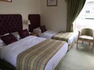 Letto o letti in una camera di Faythe Guesthouse