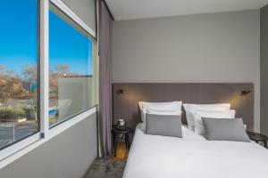Кровать или кровати в номере Apartamentos Turisticos Paraiso