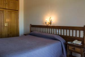 Postel nebo postele na pokoji v ubytování Hotel El Molino