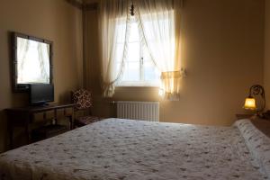 Postel nebo postele na pokoji v ubytování Hotel El Molino