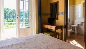 Postel nebo postele na pokoji v ubytování Hotel El Molino