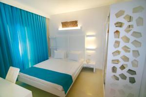 En eller flere senge i et værelse på Costa Luvi Hotel - All Inclusive