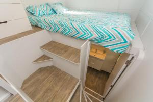 Postel nebo postele na pokoji v ubytování Tiny House Siesta