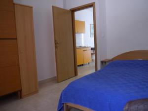 Postel nebo postele na pokoji v ubytování Apartment Dragovic