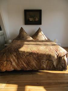 Een bed of bedden in een kamer bij Kalkmarkt Suites
