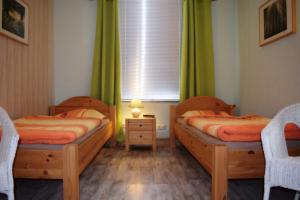Katil atau katil-katil dalam bilik di Ferienhaus Bendsieferhof