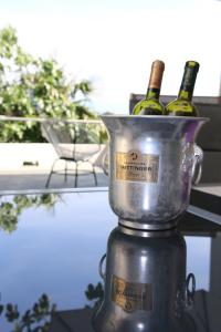 two bottles of wine in a bucket on a table at Central House Nona in Crikvenica