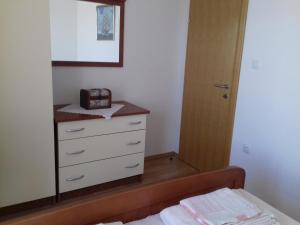 Postel nebo postele na pokoji v ubytování Apartmani Prpić