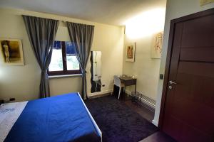 Ένα ή περισσότερα κρεβάτια σε δωμάτιο στο Villa La Mattina