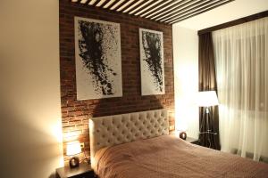 Postel nebo postele na pokoji v ubytování Апартаменты LOFT в жк Срібний дім