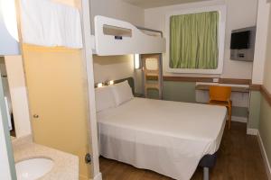 Кровать или кровати в номере ibis budget RJ Praia de Botafogo