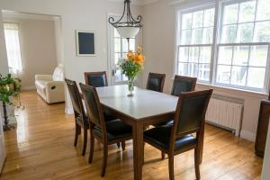 a dining room with a table and chairs at Gîte La Belle Aventure B&B in Grand-Mère