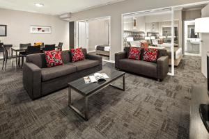 a living room filled with furniture and a couch at Quest Campbelltown in Campbelltown