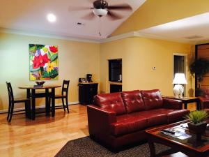 a living room with a couch and a table at Southern Comfort Suites in Mayfield