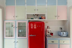 A kitchen or kitchenette at The 50's Beach House