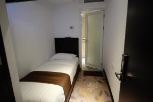Postel nebo postele na pokoji v ubytování InnB Park Hotel