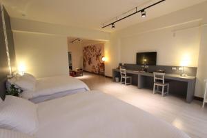 Postel nebo postele na pokoji v ubytování Yuncourt B&B