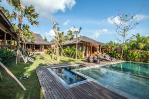 an image of a villa with a swimming pool at Marika Sawah Villa in Seminyak