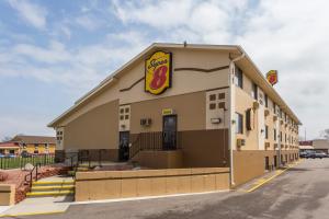 a building with a fast food restaurant at Super 8 by Wyndham Janesville in Janesville